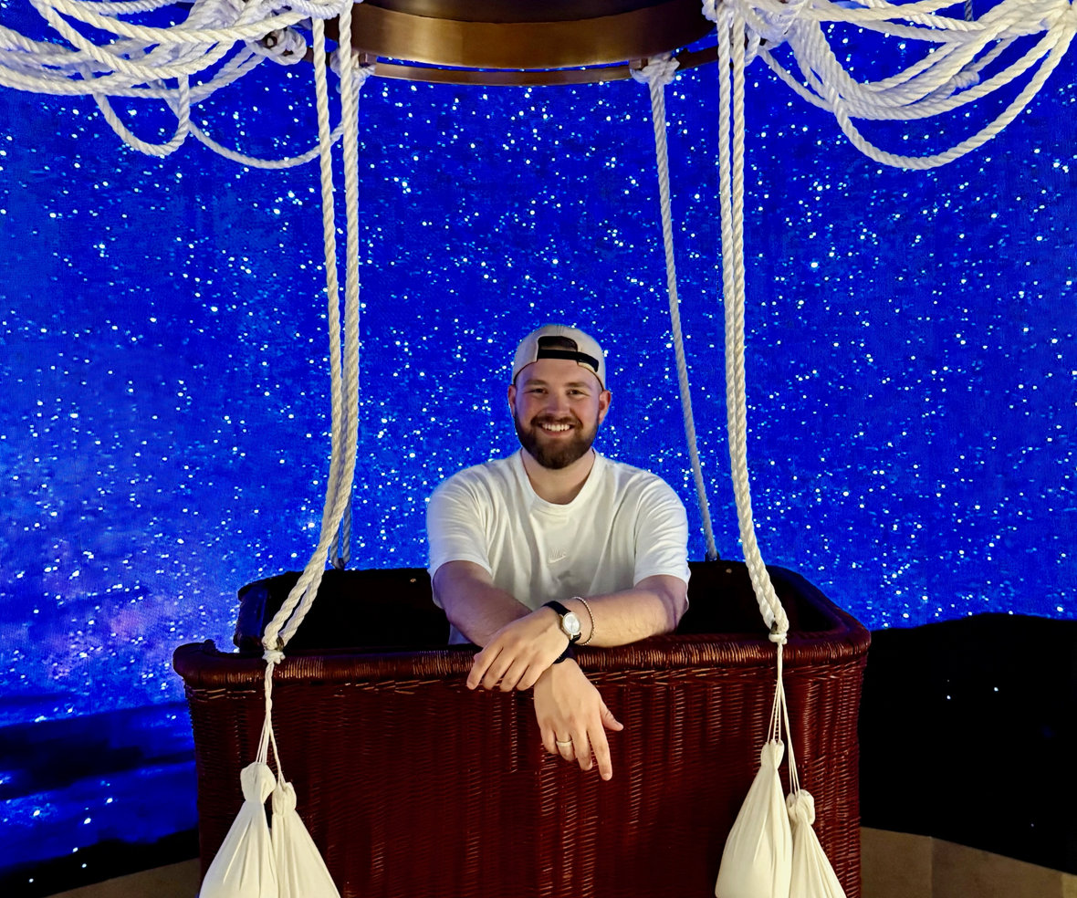 Zane Baker, founder of Romin' Round, at an amusement park